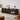 Modern black entertainment stand angled view showing decor and drawer layout.