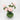 Overhead shot of green vase holding pink peonies
