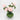 Overhead shot of green vase holding pink peonies