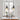 pair of black industrial pendant lights hanging over white dining table