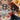 Person standing on patterned jute rug next to woven chair