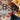 Person standing on patterned jute rug next to woven chair