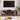 Rattan sliding doors partially opened to reveal internal storage compartments on the TV stand