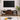 Rattan sliding doors partially opened to reveal internal storage compartments on the TV stand