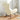 Rear angle of beige teddy rocking chair on orange checkerboard rug