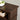 Rich espresso finish and wood grain detail on top surface of the TV stand.