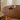 a round dining table for 4, showing the smooth wooden table-top