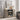 Rustic farmhouse console styled as a decorative sideboard with leaning framed art.