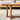Side close-up of walnut coffee table with rattan panel legs