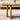 Side close-up of walnut coffee table with rattan panel legs