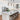 Three rustic pendant lights above kitchen island with place settings