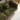 Green sofa with cushions in a room setting