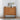 Walnut buffet cabinet styled in a bright room with framed art and vase