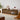 Walnut LED entertainment console in living room corner with warm tone decor.