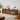 Walnut LED entertainment console in living room corner with warm tone decor.