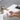 washing hands under brushed gold bathroom faucet water stream