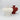 White ceramic vase with red variant in background