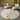 Circular Light Khaki & Gold Area Rug with sofas and a lamp
