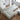 wide angle view of white sofa with lamp