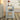 White end table with decorative items.