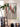 living room with plant and wall art